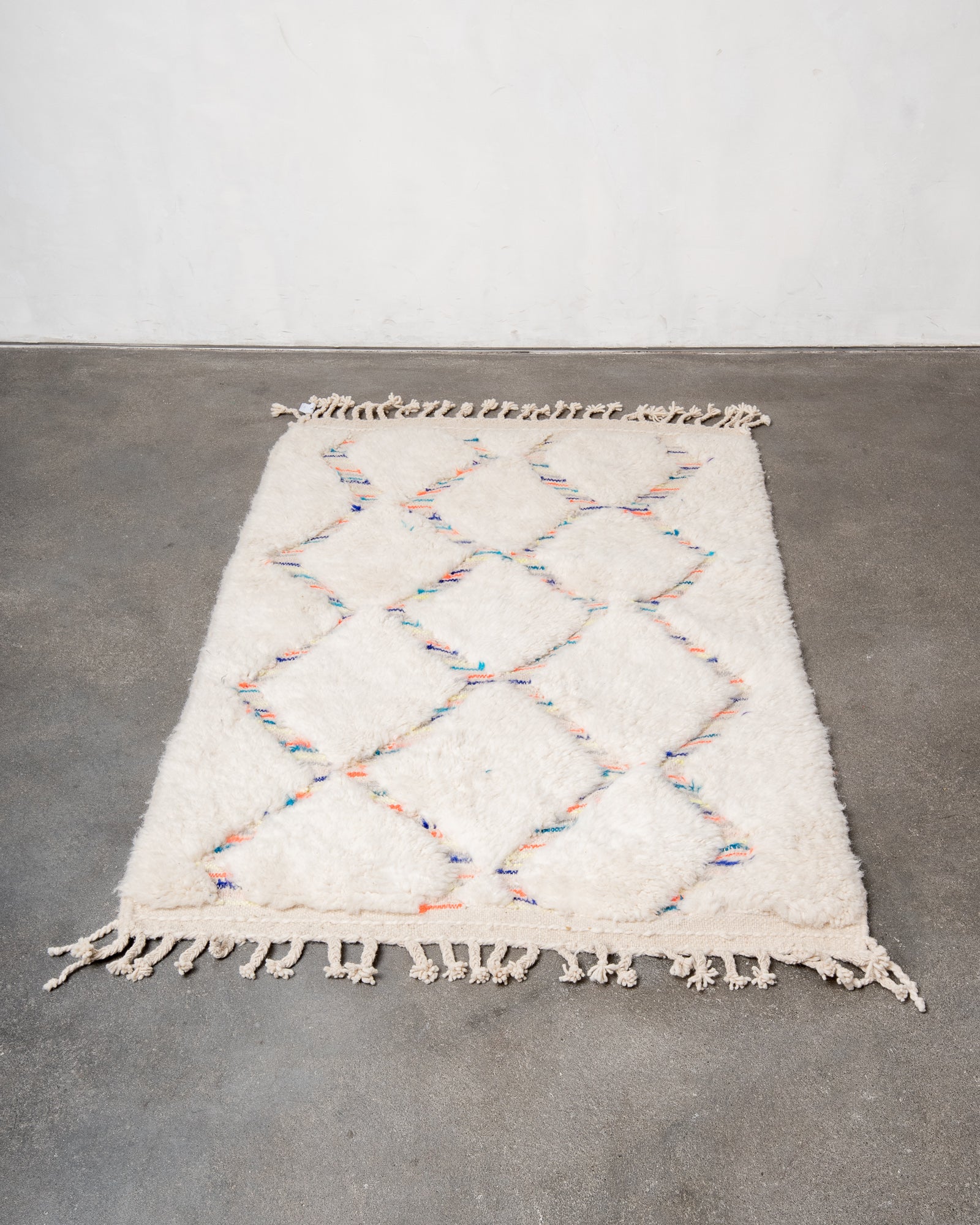 Modern, designer, handcrafted Berber rug from Morocco. Beniourain carpet with beautiful colours and patterns and fluffy wool texture.